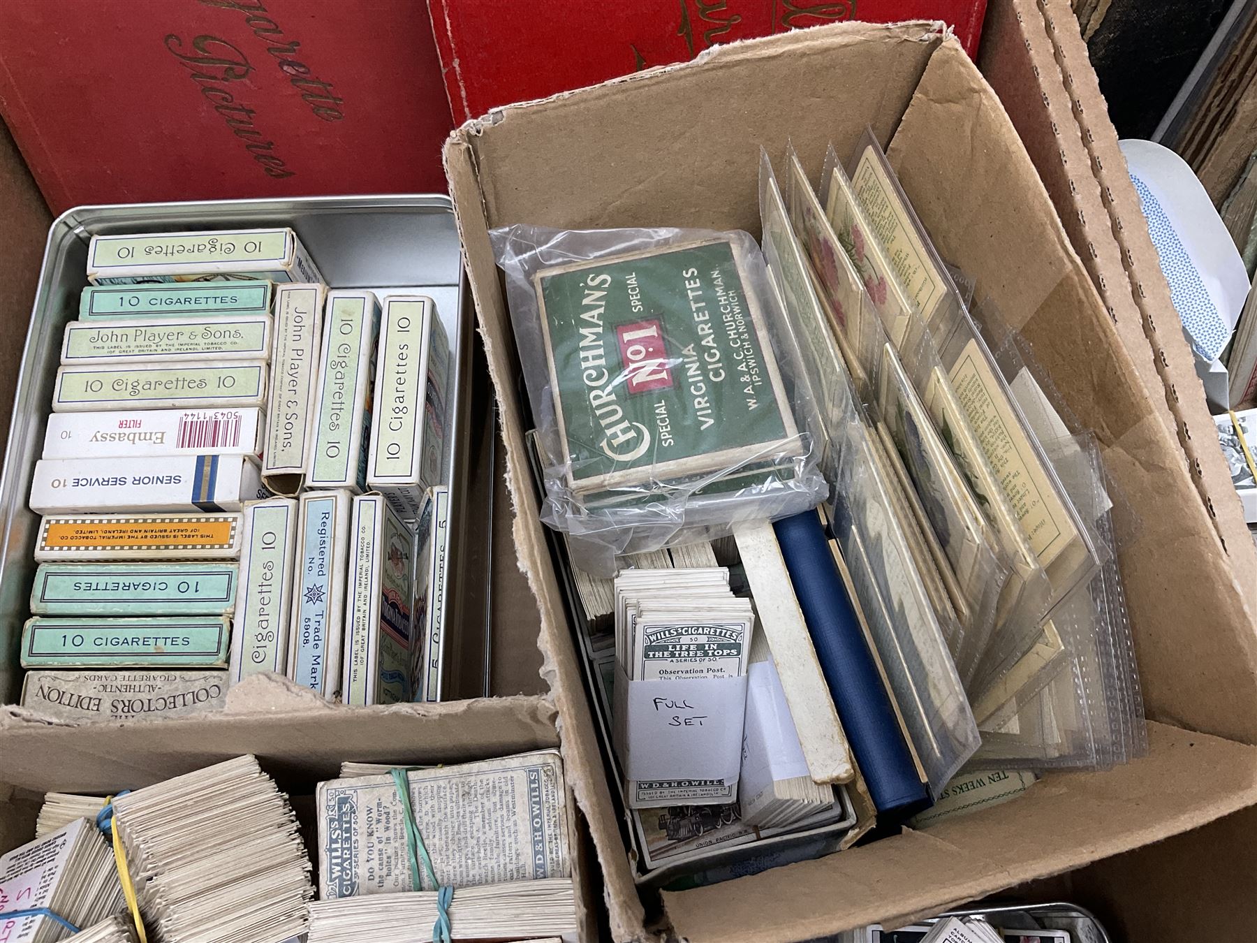 Quantity of cigarette and trade cards, housed in albums and loose, by W.D. & H.O. Wills, John Player & Sons etc, including cycling, garden hints, Britain's railways, dogs etc and various empty vintage cigarette card albums, in two boxes