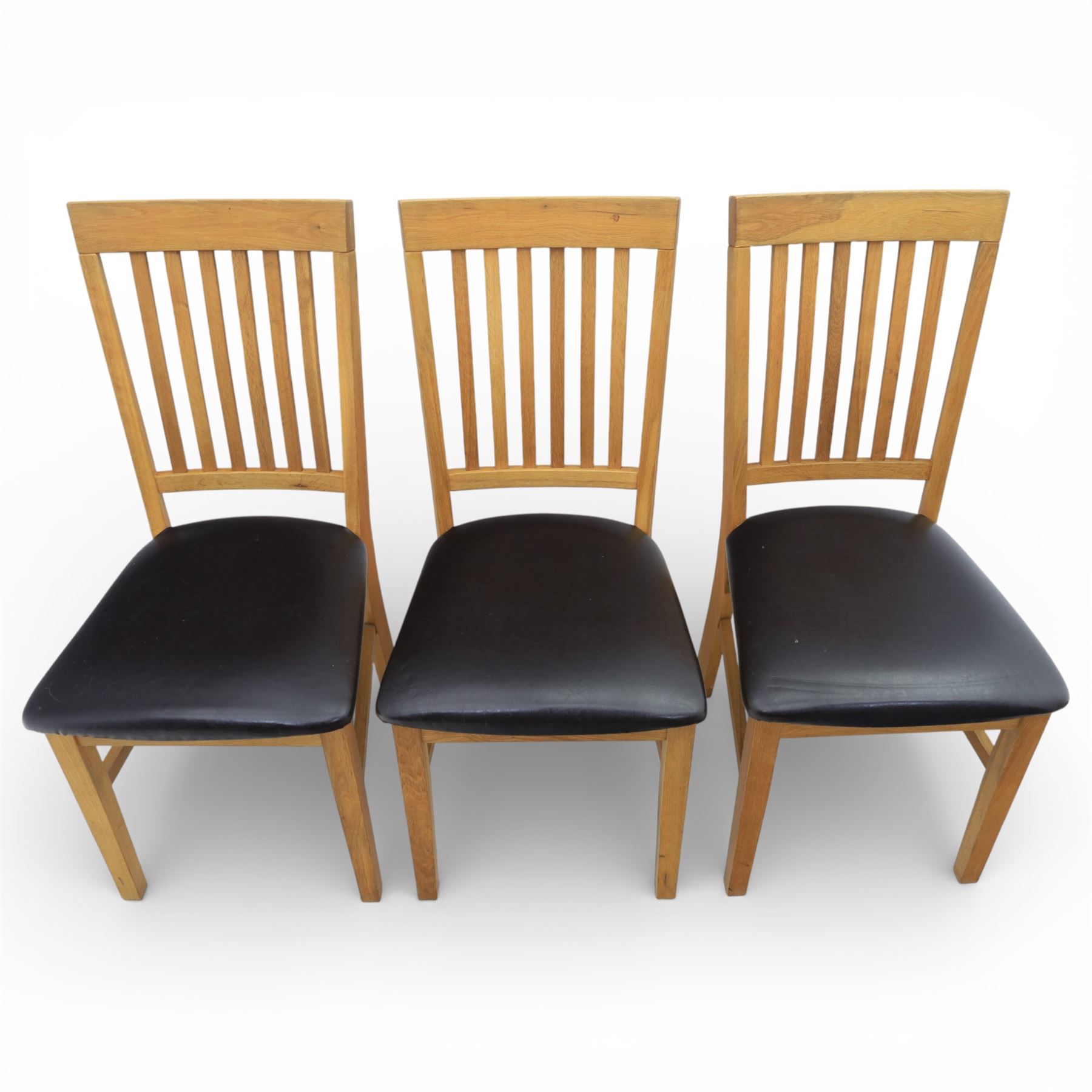 Solid light oak extending dining table with single leaf, and set of six chairs