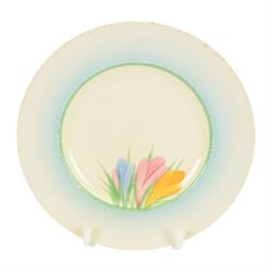 Clarice Cliff Orange Trees & House pattern side plate circa 1931, hand painted with a stylised tree and cottage landscape with orange and black banding, with printed mark beneath, together with a Clarice Cliff Spring Crocus pattern side plate, with printed mark beneath, largest D20cm  