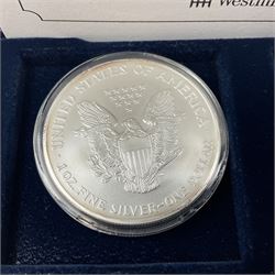 Four one ounce fine silver coins, forming 'The 2004 Famous World Silver Coin Collection', comprising United States eagle, Australian kangaroo, Chinese panda and Canadian maple leaf, cased with Westminster certificate 