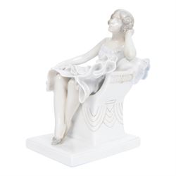 Royal Copenhagen figure no. 894, Woman Seated in a Chair, designed by Axel Locher, H20cm