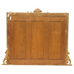 Victorian giltwood and gesso framed overmantel mirror, the scallop shell pediment with trailing acanthus leaves over a foliate moulded slip with beaded outer-edge, of rectangular arced form with floral spandrels, the base with further extending pierced scrolling acanthi decoration