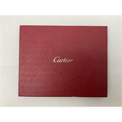 Limoges for Cartier, ceramic trinket dish, of rectangular form with rounded corners, decorated to centre with leopard upon a blue ball, with blue and gilt rim, with printed mark beneath, in original box, H15.5cm, W21cm