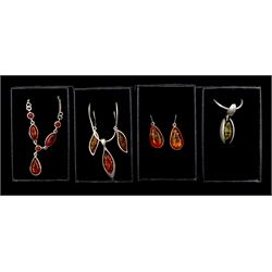Silver amber jewellery including three necklaces and two pairs of pendant earrings 