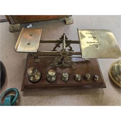 Set of Libra brass scales, a Salter spring balance, a set of wooden and brass postal scales with weights, and a collection of other brass weights 