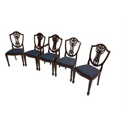 Set of five Georgian style mahogany dining chairs, pierced and carved backs, drop in seats upholstered in blue cover, on square tapering supports with spade feet