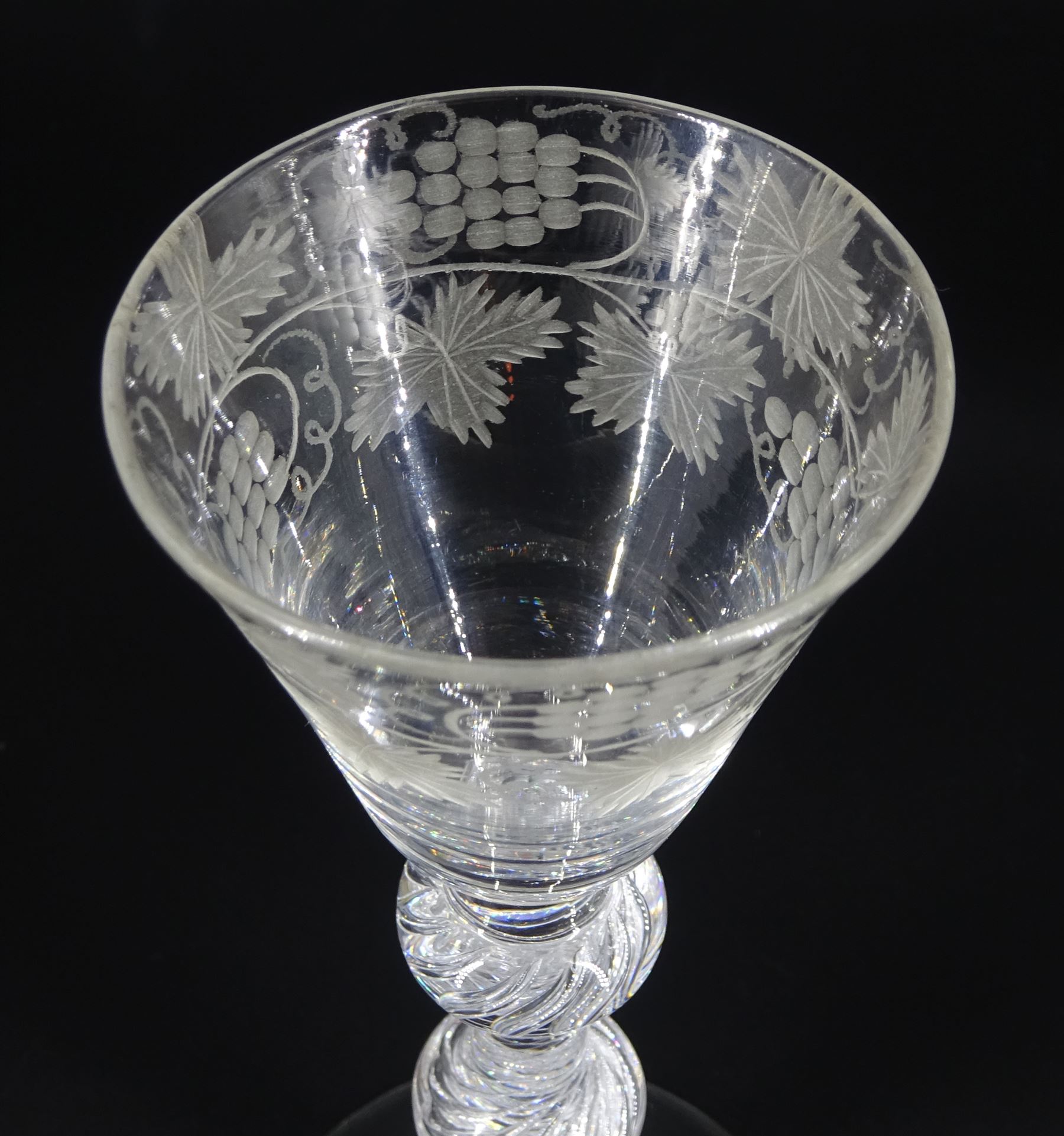 Mid 18th century wine glass, the funnel bowl engraved with fruiting vines upon a single series air twist double knopped stem and conical foot, H16.5cm
