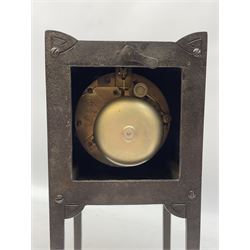 A German Arts and Crafts 'Gesamtkunstwerk' mantle clock c1890 in a square formed iron case with abalone incised triangles to each corner, case raised on four legs with inward facing feet,  convex copper chapter ring hand engraved with upright Arabic numerals, conforming copper hands in an individual style, with an eight-day spring driven rack striking movement manufactured by Lenzkirch, striking the hours and half hours on a bell, conforming steel pendulum with a hand-crafted faceted pear-shaped copper bob. With key.
Lenzkirch were one of the most prolific and respected German clock manufacturers of the 19th and early 20th century, it is highly probable that this movement was removed from another clock and incorporated into this artisan case when made at the end of the 19th century.