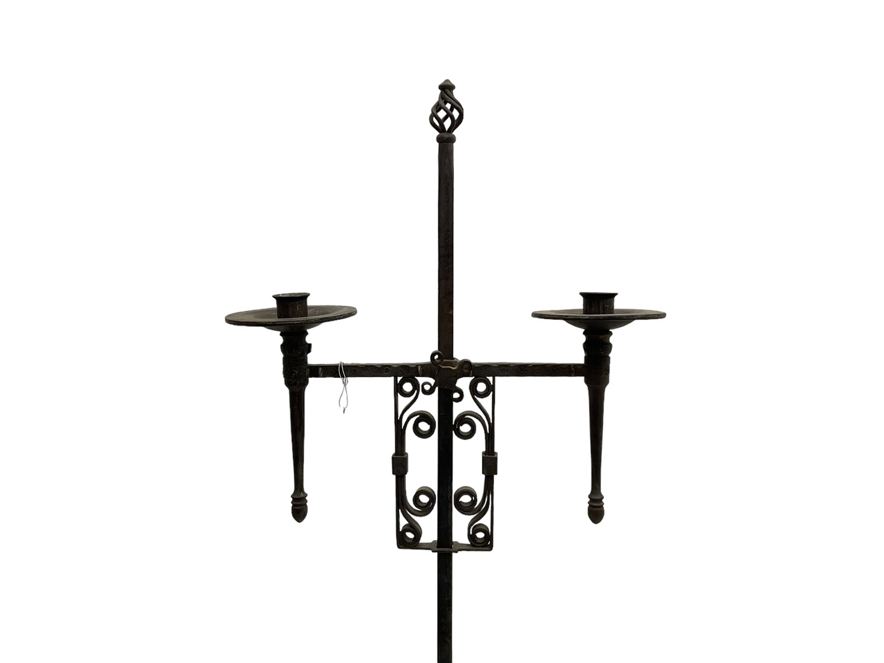 Ironwork candle holder stand, with stamped decoration, adjustable two branch sconces with scrolled iron work, twist stem with arched supports with scrolled terminals
