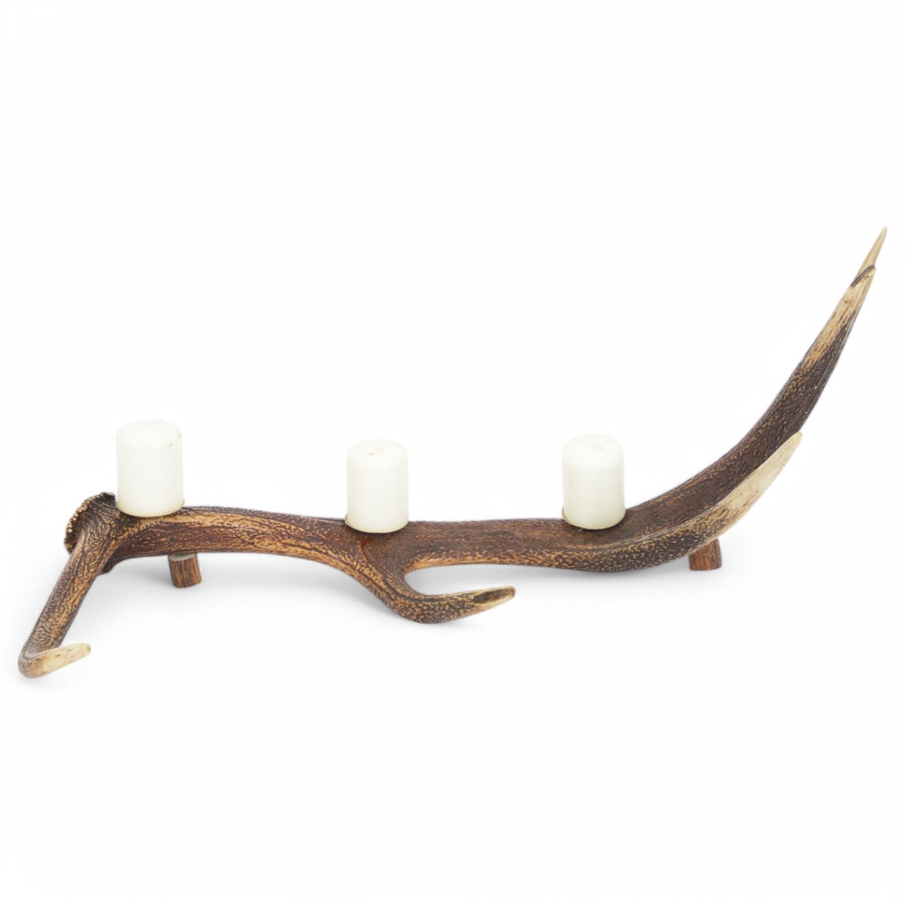Red stag antler centre piece, made from a single antler with three candle holders to the centre, L78cm, H33cm  