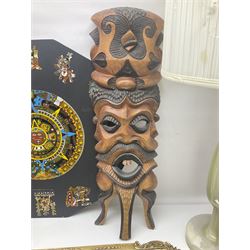 Onyx table lamp, with cream fabric shade, together with feather picture of birds, butterfly wing picture, carved wooden mask, marquetry scene, Aztec calendar, gilt wall mirror, painted hunting scene on acetate and one other