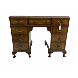 Early 20th century figured mahogany twin pedestal desk, fitted with nine oak lined drawers, cabriole feet, triple inset leather top