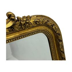 18th century design ornate gilt framed overmantle mirror, bevelled mirror plate within arched frame with pierced pediment featuring foliate and scrollwork designs