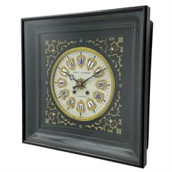 Auguste GP. Andhomme - French vineyard clock,  late 19th century 8-day twin train spring driven wall clock with enamelled and inlaid brass decoration within an ebonised and glazed case, circular enamel dial with cartouche Roman numerals, minute markers, pieced steel hands and a chased brass slip, striking movement, sounding the hours and half hours on a coiled gong. With pendulum and key.  
