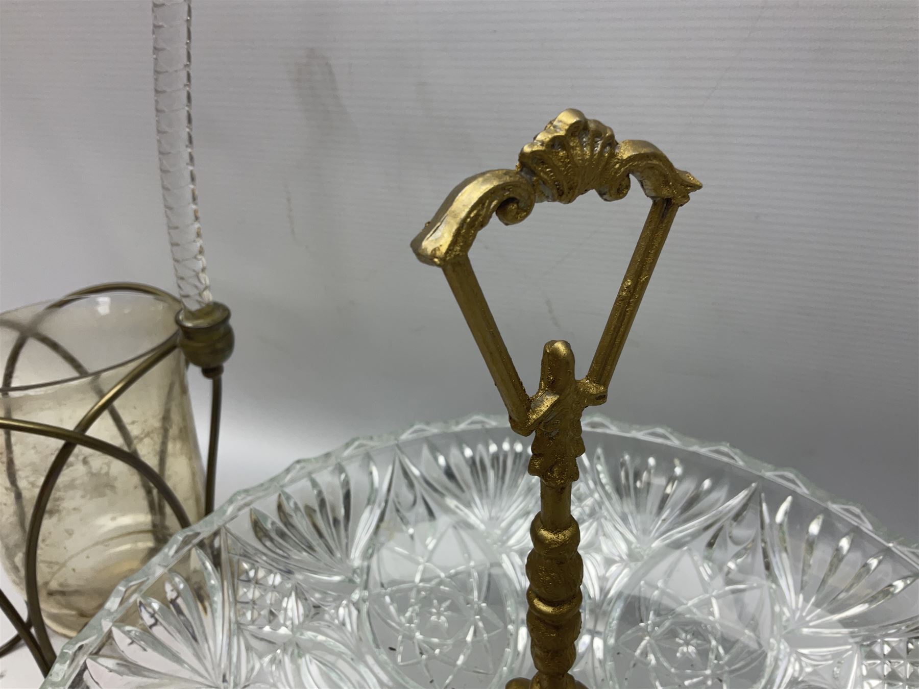 20th century moulded glass and gilt centre piece bowl with carrying handle and ornate trefoil base, together with frilled cranberry edge glass comport with ornate gilt base, and further centre piece with  large glass handle of twisted form, tallest H54cm