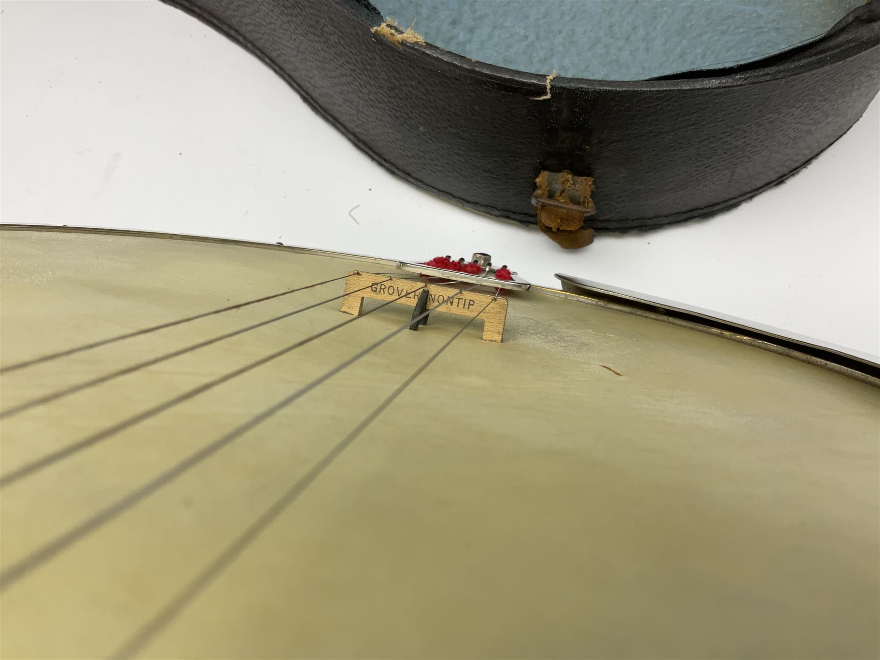 Five-string banjo by Clifford Essex Co. 15A Grafton Street, Bond Street, London W, with mother-of-pearl inlaid ebony fingerboard L92cm; in carrying case with strap
