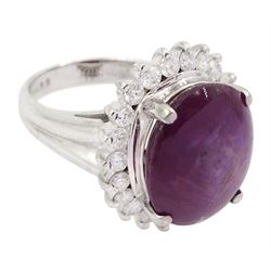 Platinum cabochon star ruby and round brilliant cut diamond cluster ring, stamped Pt900, ruby 12.57 carat, total diamond weight 0.88 carat