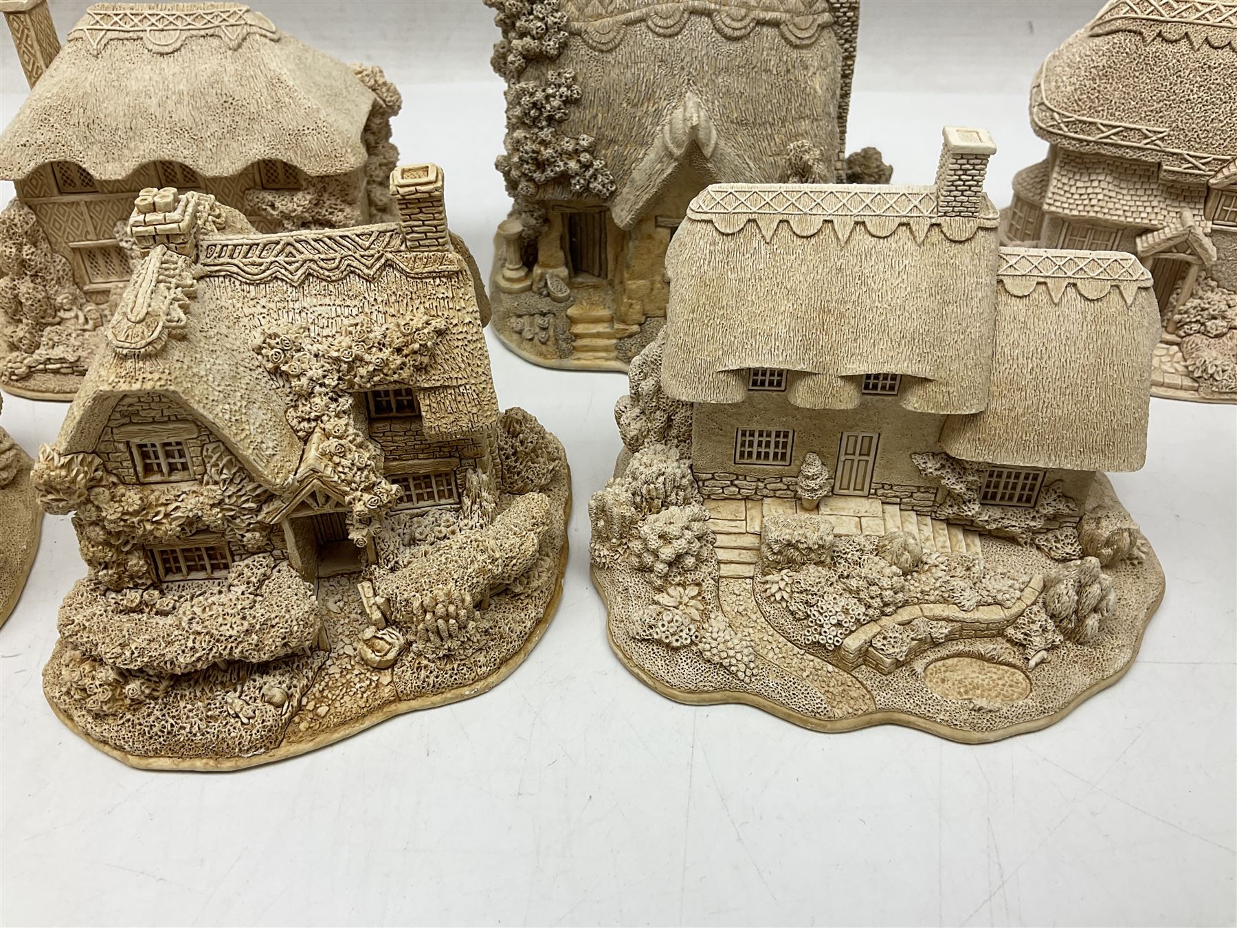 Twenty-three Lilliput Lane models from the Paint Your Own collection, to include Catmint Cottage, Sugar and Spice, Gypsy Cottage, Ruby Cottage and Little Birch, some boxed