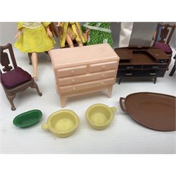 Seven Pippa dolls and a collection of plastic dolls house furniture
