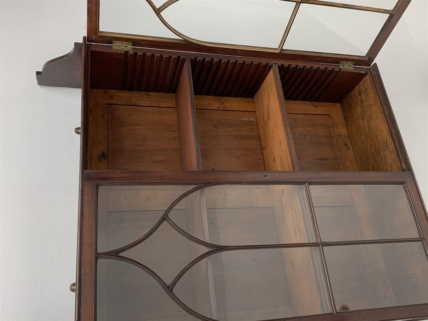Georgian mahogany Gothic wall hanging cabinet, enclosed by two ogee pointed arch astragal glazed doors, plain sides with shaped top and bottom brackets