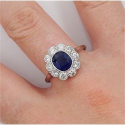 Palladium and platinum milgrain set oval sapphire and diamond cluster ring, sapphire approx 1.35 carat, total diamond weight approx 0.55 carat