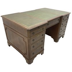 Mid -20th century Georgian design mahogany twin pedestal desk, moulded reverse breakfront top with three sectional inset leather top, fitted with single frieze drawer flanked by eight graduating cock-beaded drawers, each with corssbanded and strung facias, with fluted canted corners, on bracket feet