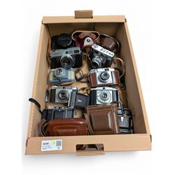 Collection of vintage cameras, including Zeiss Ikon, Canon Canonet, Ensign, etc
