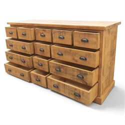 Indigo Furniture - large rustic oak combination chest sideboard, fourteen drawer with blackened metal cup handles, on a plinth base