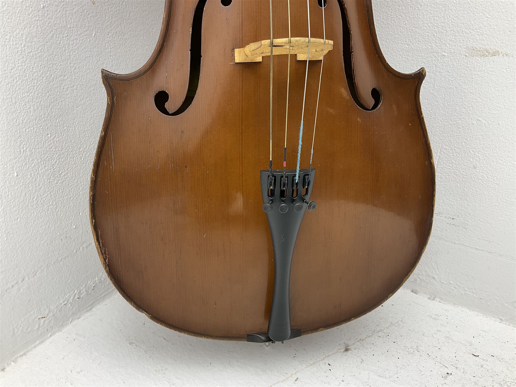 Modern Romanian student's three-quarter size cello with 70cm two-piece maple back and ribs and spruce top, bears label 'Musikinstrumentenfabrik Reghin Romania' L115cm overall
