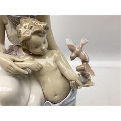 Lladro figure, Where Love Begins, modelled as a mother of child feeding birds, numbered beneath 7649, H33cm