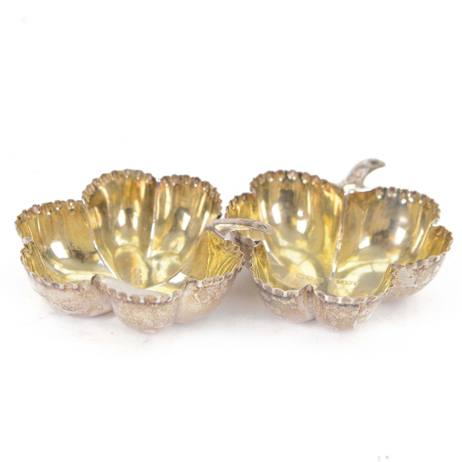 Pair of Victorian silver open salts, of trefoil shamrock form with crimped rims and gilt interiors, hallmarked Joseph Jennens & Co, Birmingham, H2cm, L5cm