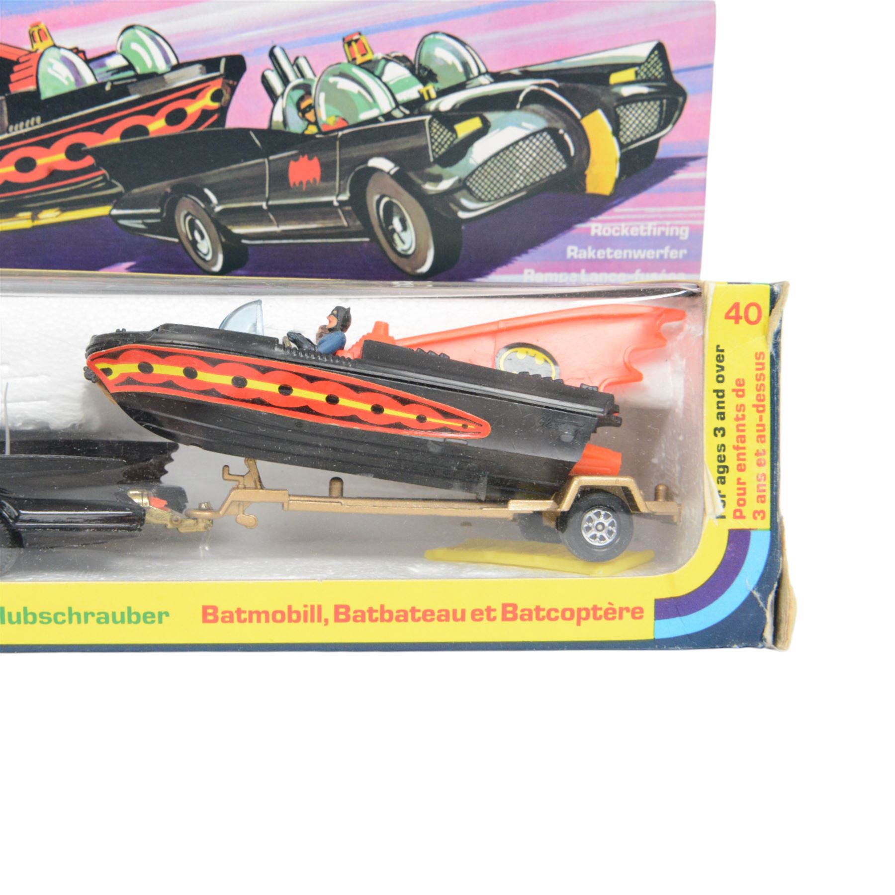 Corgi Batman Gift Set no. 40, comprising Batmobile, Batcopter, Batboat on trailer and twelve yellow plastic missiles on sprue, in original window box with pictorial header card and polystyrene interior, with outer cardboard protector