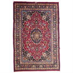 Central Persian Kashan hand-knotted carpet, rose red field, with central shaped lobed meda...