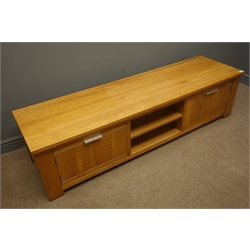  Light oak television stand, centre shelves flanked by two cupboards, stile end supports, W180cm, H46cm, D51cm  