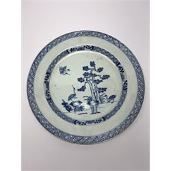 Late 18th/early 19th century Chinese export blue and white plate, of circular form decorated with pine tree and three cranes, together with a pair of smaller examples decorated with pine tree, peony and fence, each within foliate and trellis borders, largest example D28.5cm, smaller pair D23cm 