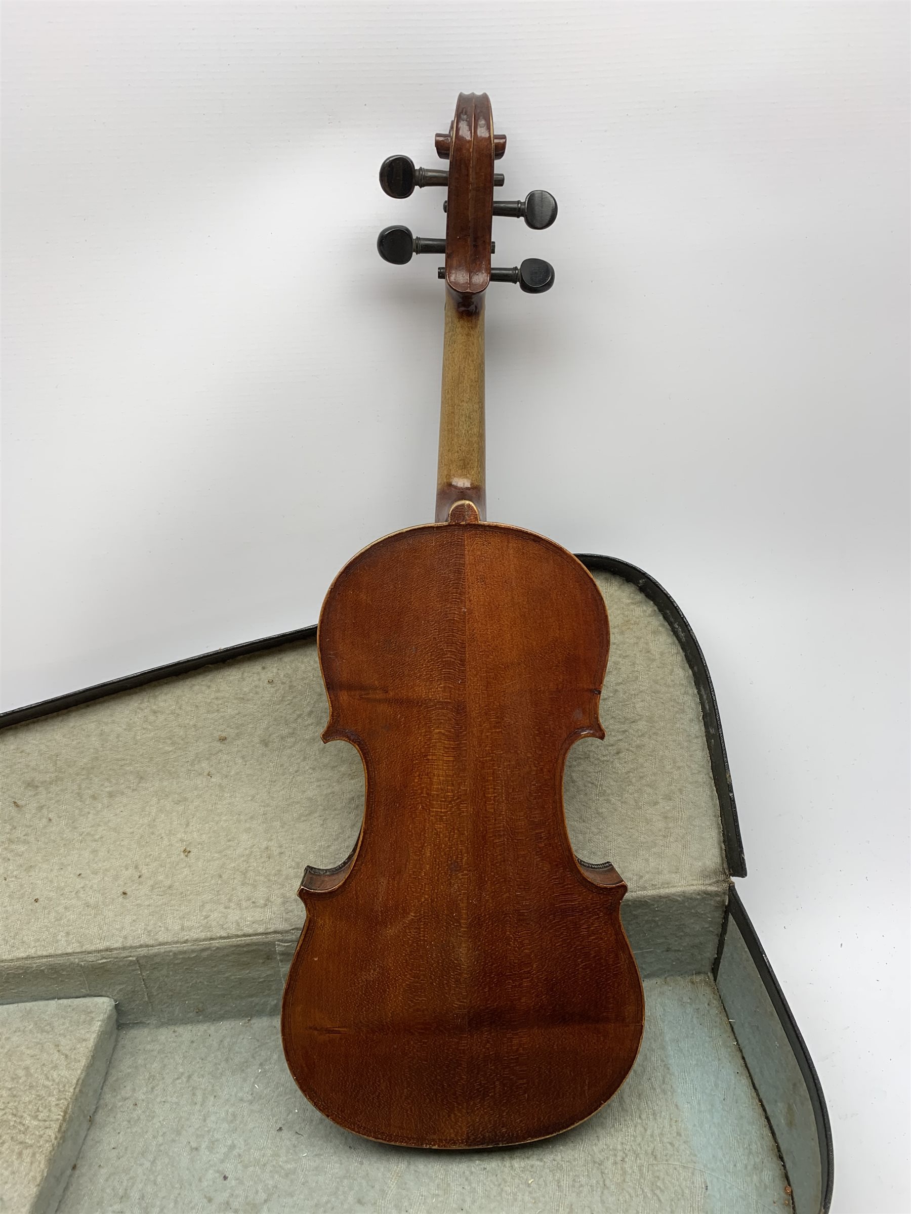 1920s German violin for completion with 36cm two-piece maple back and ribs and spruce top, lacks tailpiece, bridge and strings, 59cm overall, in carrying case