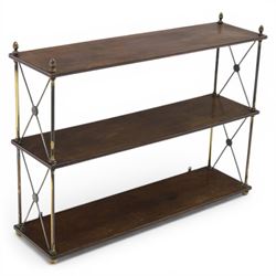 Regency brass and mahogany wall shelves circa 1820, the three shelves contained within a brass cross brace with brass finials, with wall fixings 
