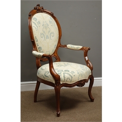 Victorian style walnut framed open armchair, cameo back with carved cresting rail, scroll carved arm supports, cabriole legs, upholstered in patterned fabric, W67cm  