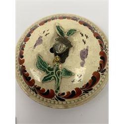 18th century creamware teapot, probably Leeds, with reeded entwined handle and floral finial to the cover, the body with hand painted polychrome decoration of figure to one side, and floral spray to the other, collectors paper label beneath inscribed Leeds Pottery, H11.5cm