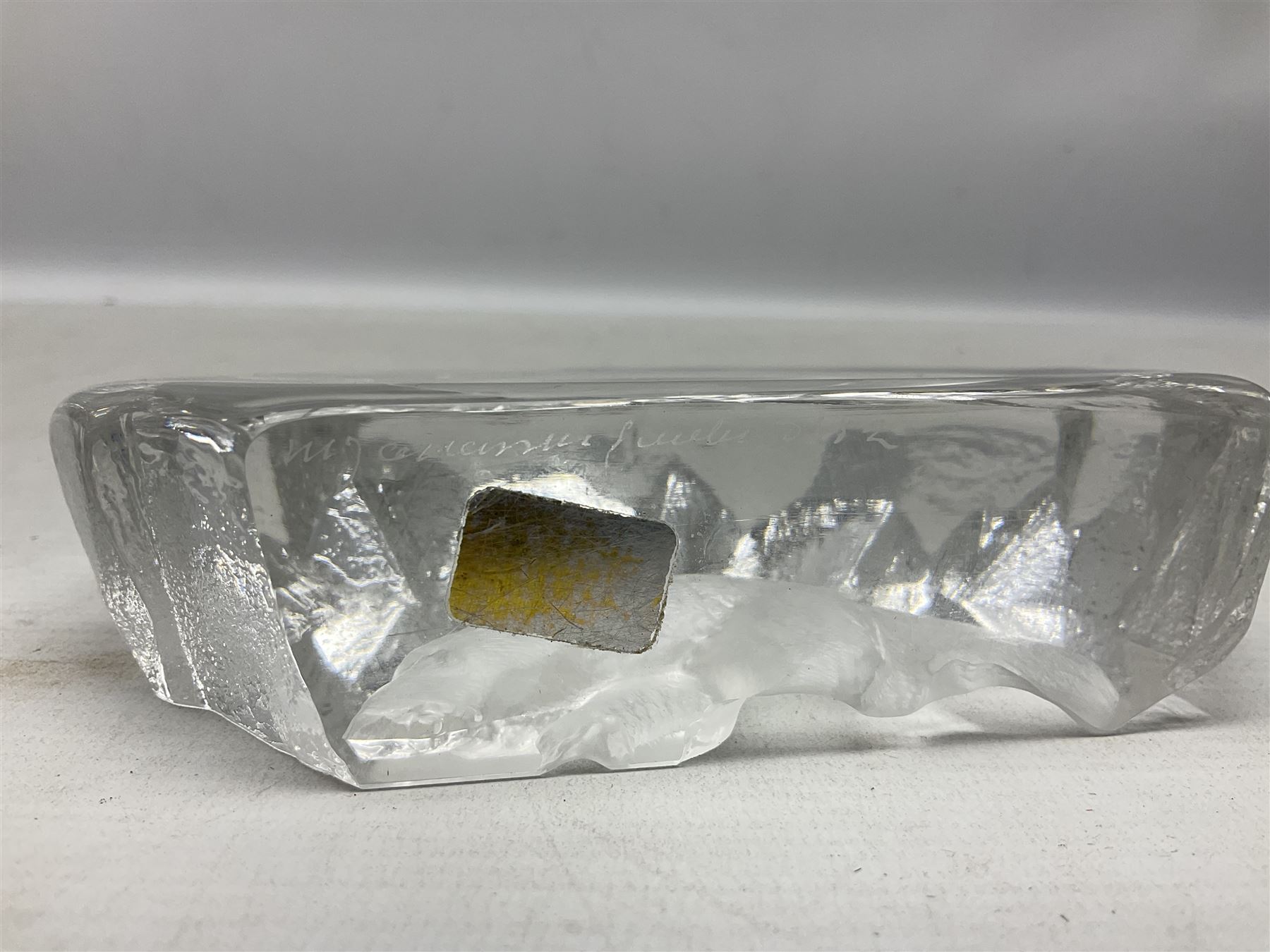 Two Mats Jonasson, Sweden paperweights, comprising polar bear in ice cave no 3152 and lion cubs, both with etched marks beneath, tallest H11.5cm