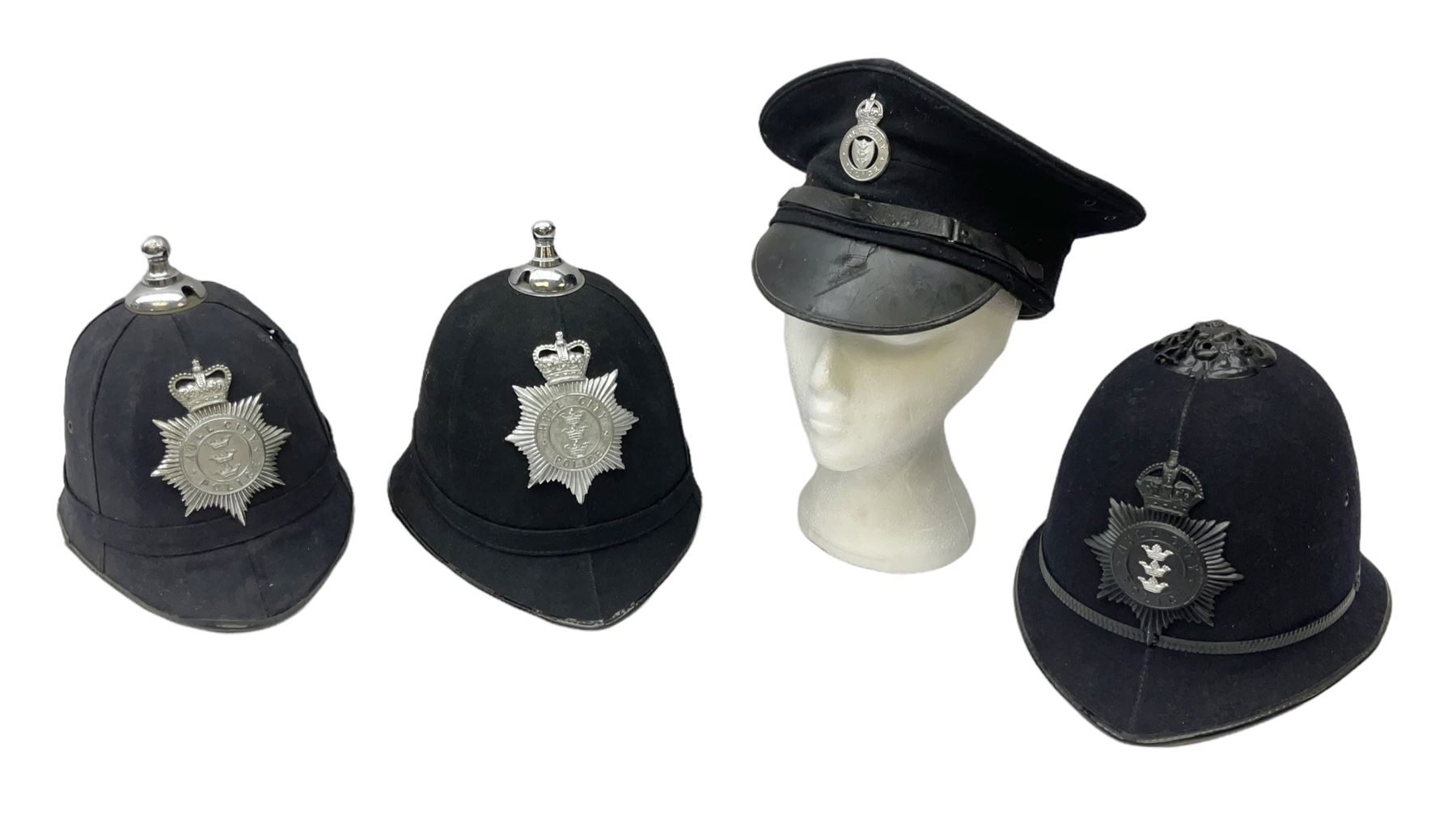 Hull City Police - helmet with king's crown night plate; two further ball-top helmets with Queen's crown plates; and a peaked cap (4)