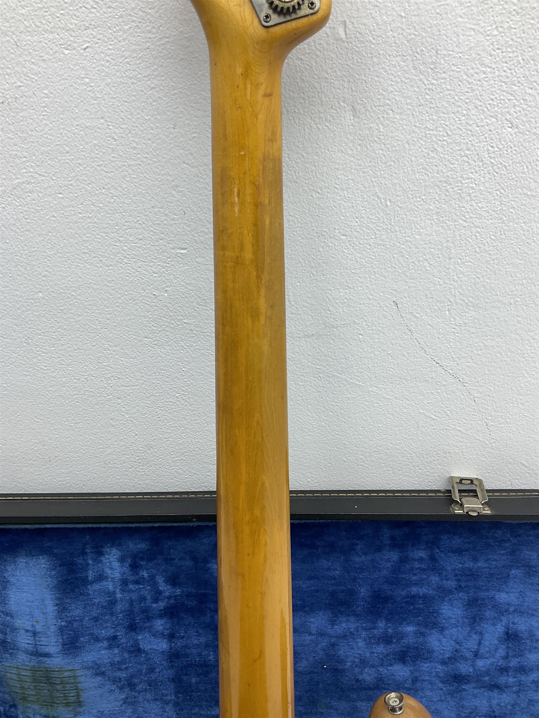 1962 Fender Precision bass guitar; re-finished in natural alder in the 1970s; impressed date code 5NOV62C to end of neck and serial no.90537 to back plate; L115.5cm; in replacement hard carrying case