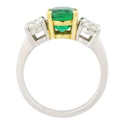 Platinum emerald and diamond three stone ring, single cushion cut emerald of approx  1.85 carat, set with a single round brilliant cut diamond either side, hallmarked, total diamond weight approx 1.20 carat