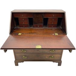 George III mahogany bureau, sloped fall front enclosing fitted interior, four long graduating drawers and two sliding stays, on bracket feet