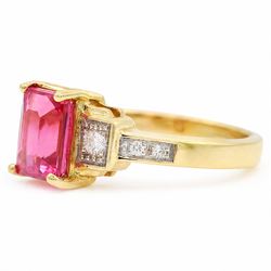 18ct gold pink pink spinel and diamond ring, single emerald cut spinel of approx 1.85 carat, with a round brilliant cut diamond set either side and diamond set shoulders, Birmingham assay mark