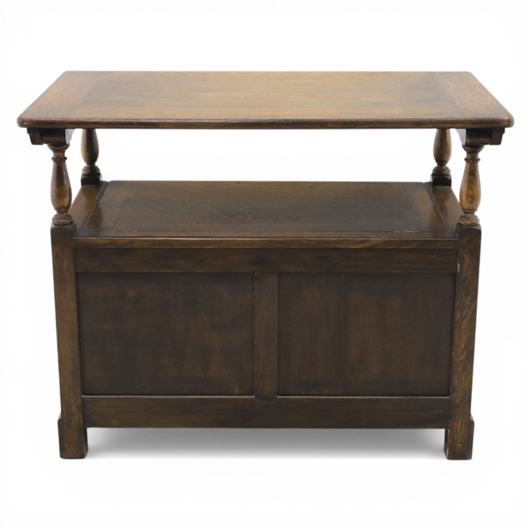 20th century oak monks bench with hinged box seat, with blind fretwork to the seat, panelled front and sides with linen fold panel in the centre