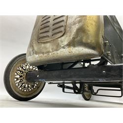 Mid 20th century pressed steel pedal car, the body painted in dark green fitted with pretend radiator to the bonnet, with spoked wheels and rubber tyres, the interior with pedals and steering wheel, L70cm