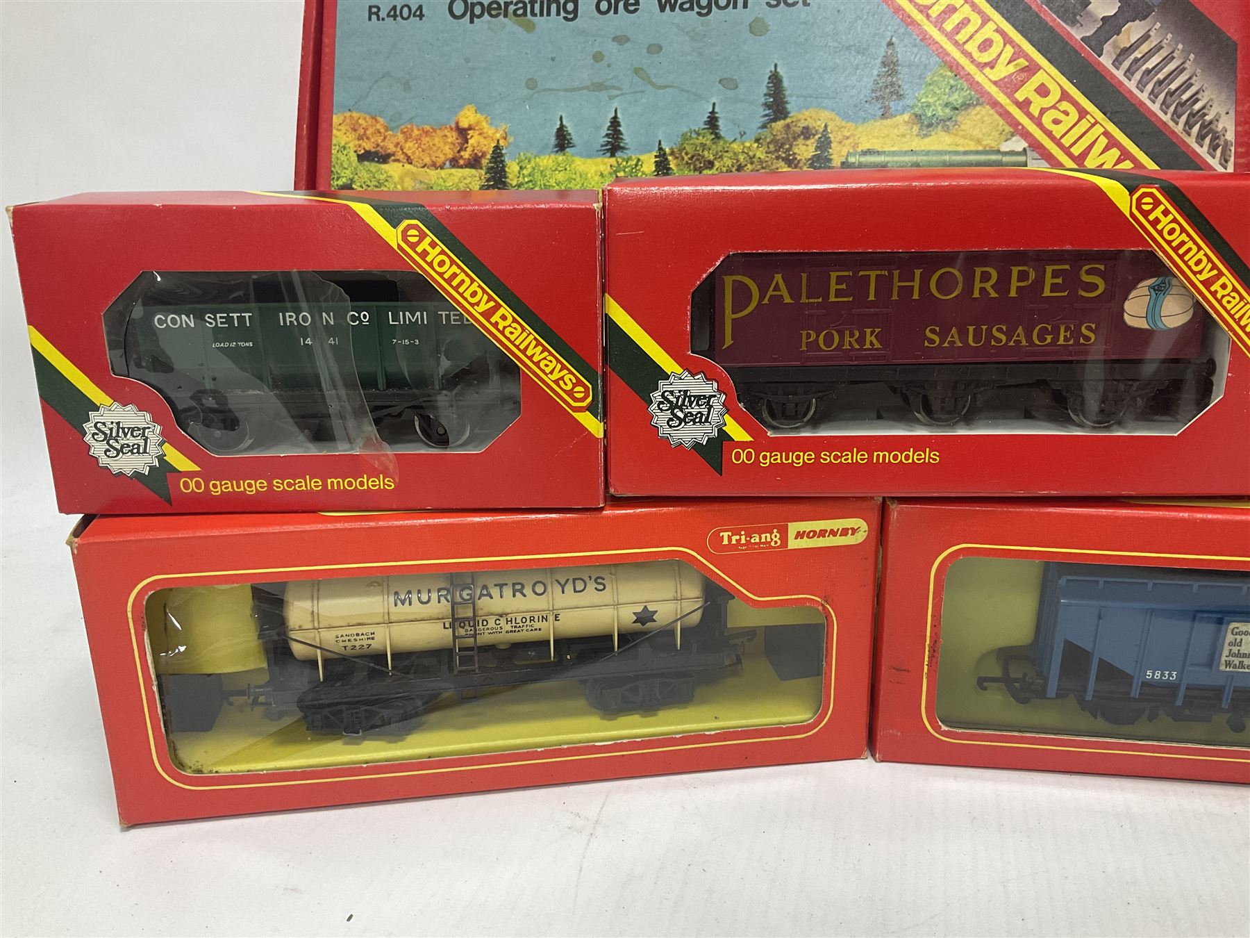 Hornby/Tri-Ang ‘00’ gauge - fifteen goods wagons to include freightliners with containers, ore wagons, closed vans etc; together with R404 Operating ore wagon set; all boxed (16) 