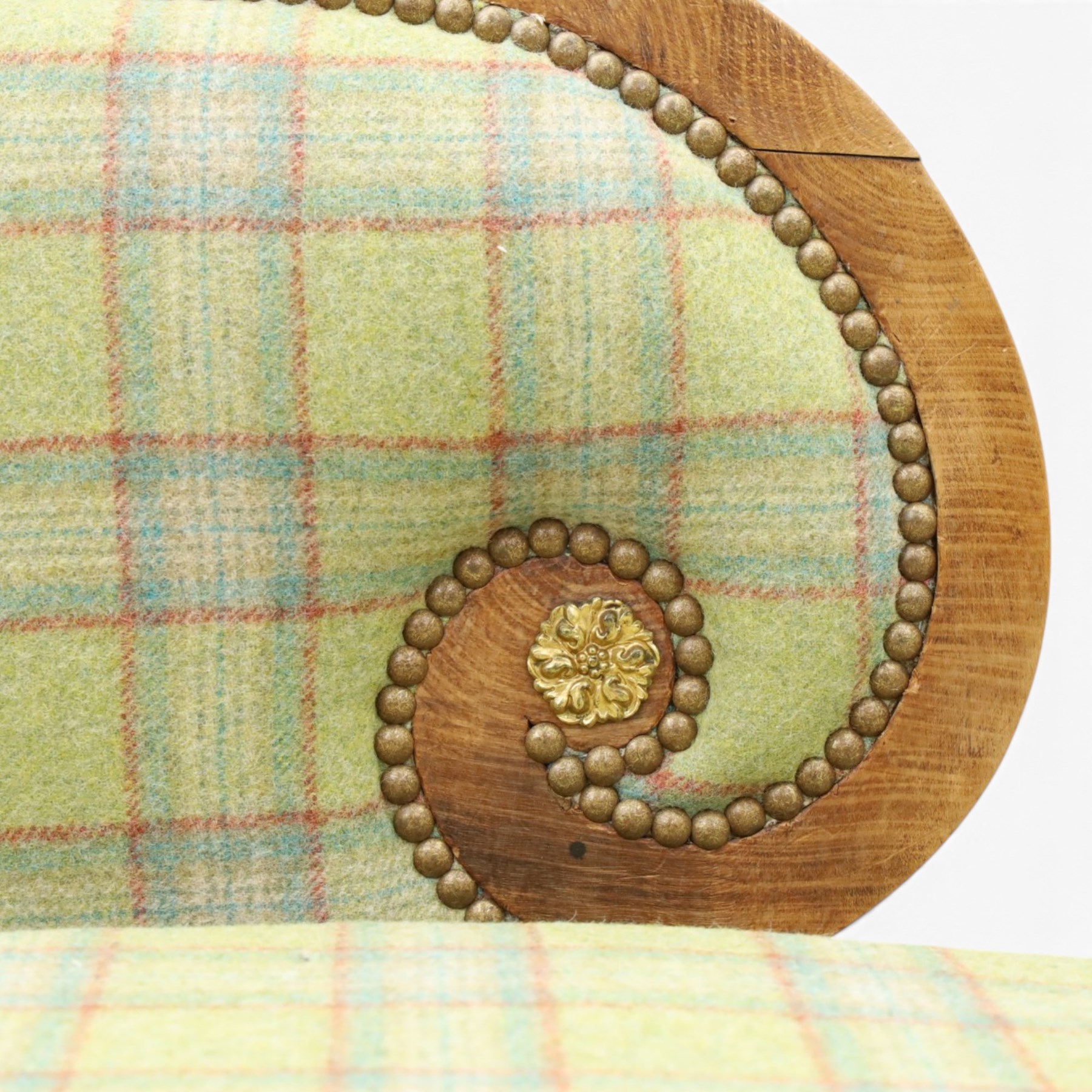  19th century scumbled oak chaise longue upholstered in tartan fabric, swept frame with gilt mounts, studded border with loose base cushion, raised on turned bobbin supports terminating brass castors