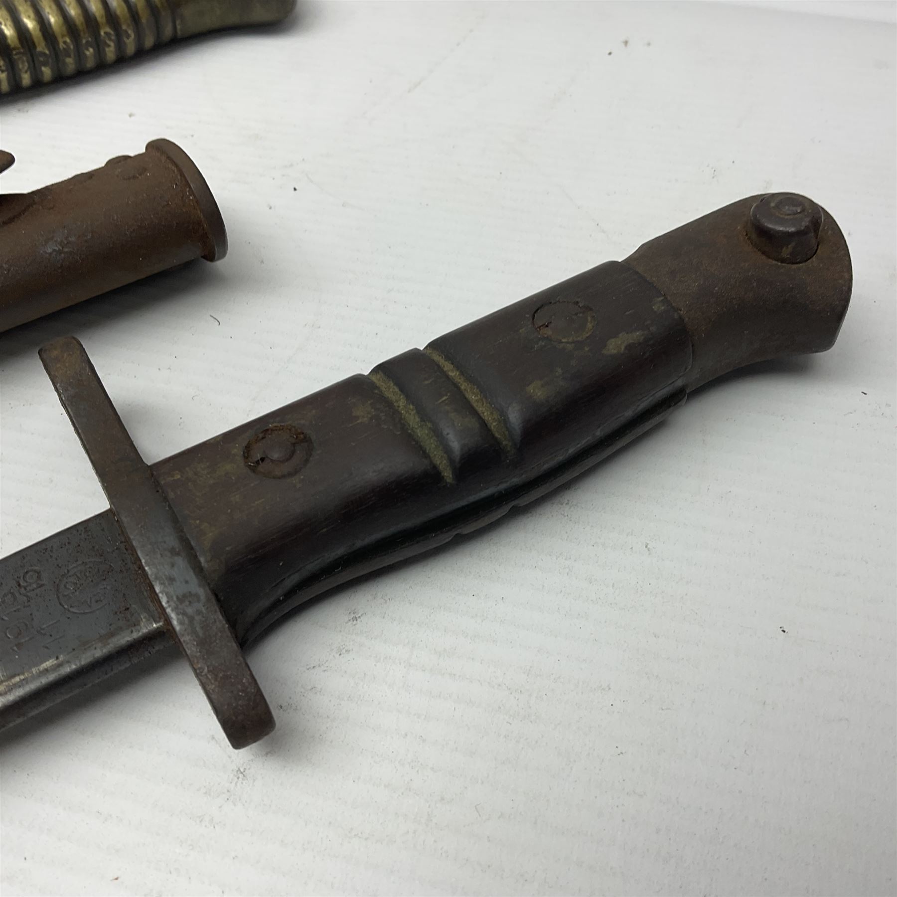 WWI Remington Pattern 1913 bayonet, the 43cm fullered blade with various marks to the ricasso including date code 11 16; in leather covered scabbard with various stamps including JWB 17 L58cm overall; and a French Model 1866 sabre bayonet (no scabbard)